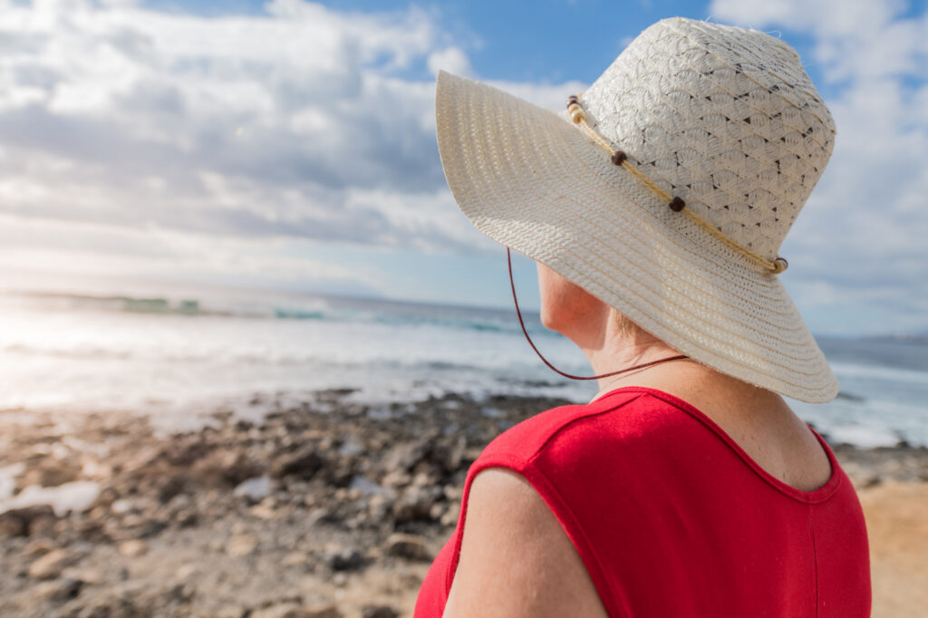 Senior standing on beach Home - LightSpring Home Care